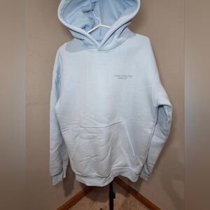 Comfrt Collections Pastel Edit Baby Blue Hoodie Size Small. New without Tags